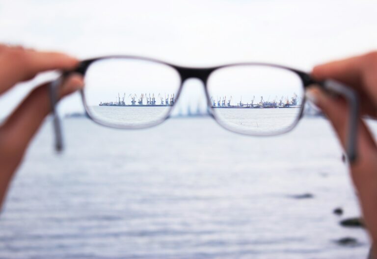 person holding eyeglasses