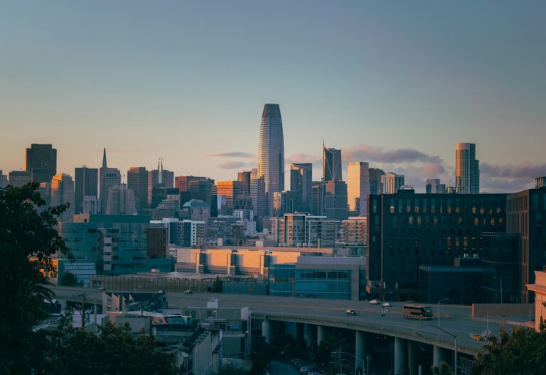 a city skyline with a bridge