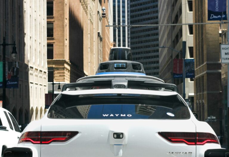 a car that is driving down the street