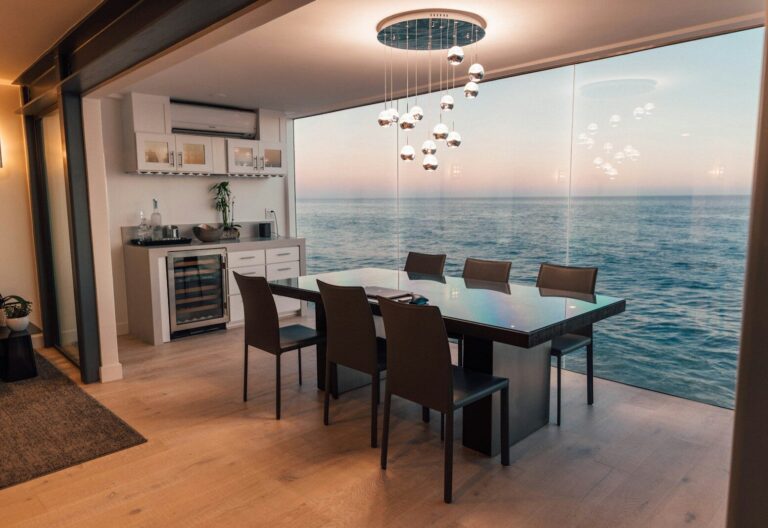 dining table set placed beside glass window