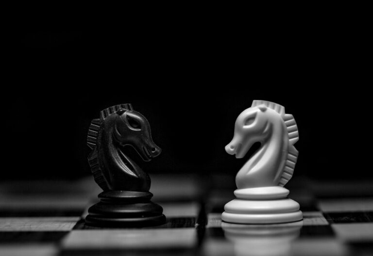 white ceramic figurine on black table